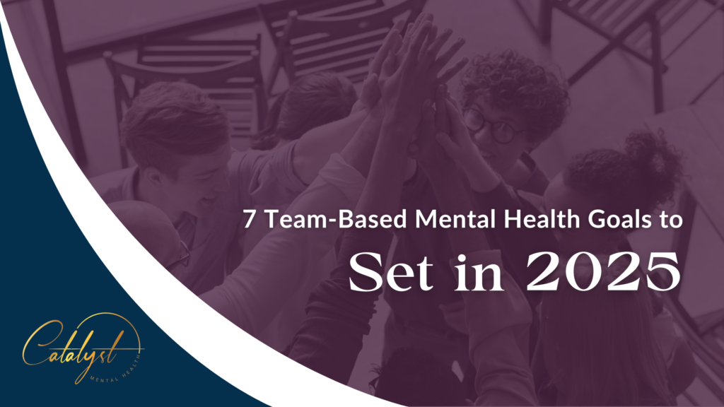 Employees do a group high-five to celebrate setting team-based mental health goals for 2025.