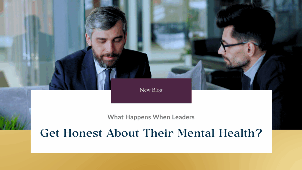 A male CEO meets with a team member in a corporate office to discuss mental health as part of their commitment to transparent leadership.